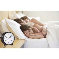 Compact Alarm Clock with Silent Second Hand and Yellow Night Light