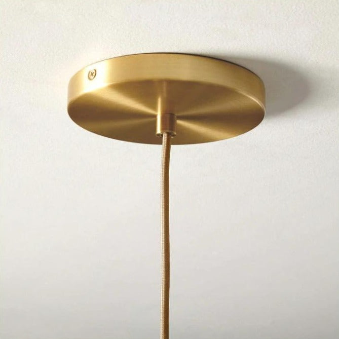 Modern Glass Globe Pendant Light in Brass Design