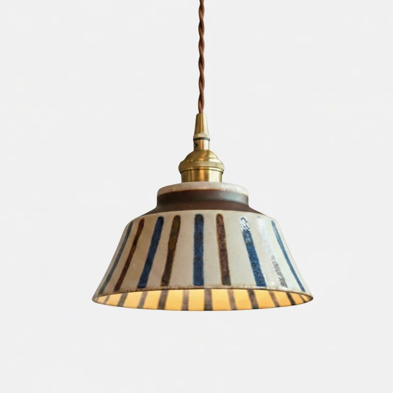 Textured Ceramic Pendant Light with Brass Details and Warm Lighting
