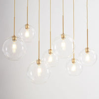 Modern Glass Globe Pendant Light in Brass Design