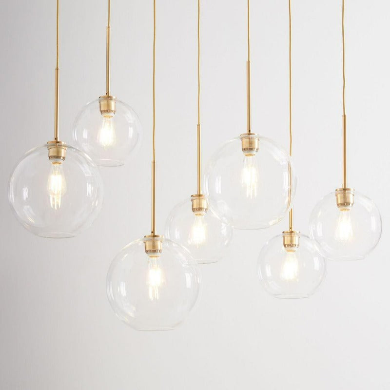 Modern Glass Globe Pendant Light in Brass Design