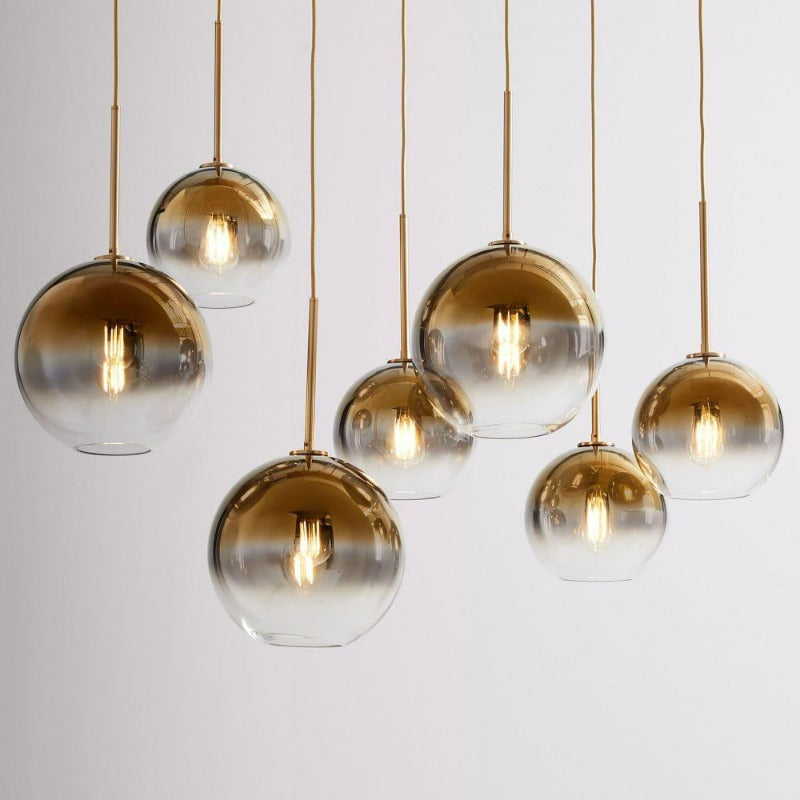Modern Glass Globe Pendant Light in Brass Design